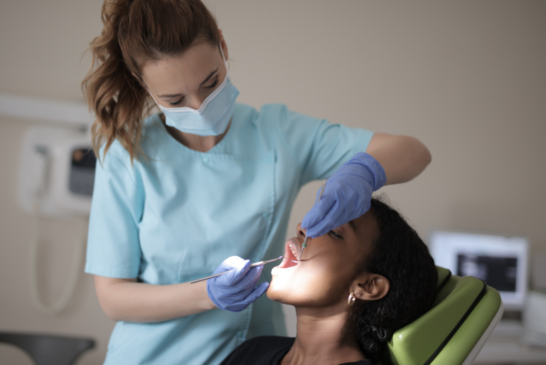 Dentist treating a women's teeth